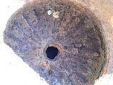 a hole in the ground that has a small hole in it