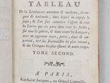 an open book with writing on it on a table