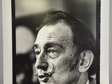 an old black and white photo of a man with a nose ring