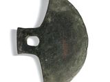 a small metal object that is on a white surface