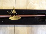a harry potter pen and a harry potter wand in a box