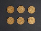 six types différents de pièces d'or sont représentés sur un fond noir