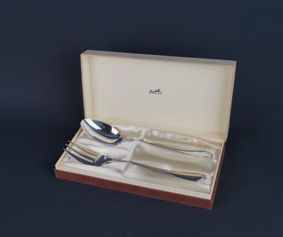 a set of silverware in a box on a table