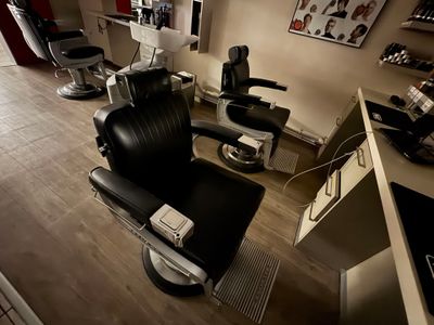 an image of a salon room with a chair and a counter