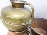 many pots and pans that are sitting on a table