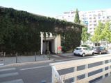 a car parked in front of a building on the side of the street