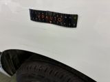 a sticker on the back of a white truck