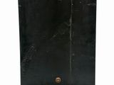 an image of a black clock on a stand on a white background