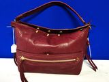 a red leather purse with gold hardware and tassels