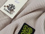 an image of a sweater with a tag that says element