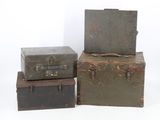 three trunks stacked on top of each other on a white surface