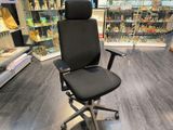 a black office chair that is in a store