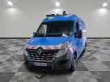 a picture of a blue van parked in a garage