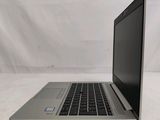 an open laptop computer sitting on top of a white surface
