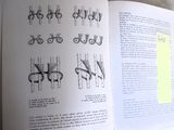an open book with a drawing of scissors on it