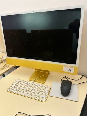 a computer on a desk with a keyboard and mouse