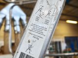 a close up of a piece of metal with a barcode on it