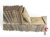 a stack of money sitting on top of a pile of books