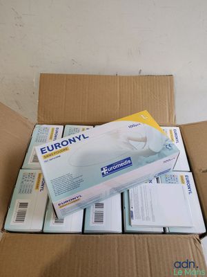 a cardboard box with a bunch of medical supplies inside of it