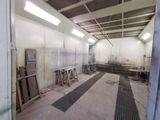 an image of a large room with a lot of work on it
