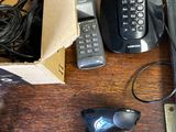 a box with a phone, a corded cord, a corded cord, a corded cord, and a corded corded corded cord