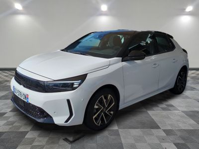 a white car is parked in a room with a checkered floor