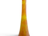 yellow and orange glass vase on a white surface with a white background