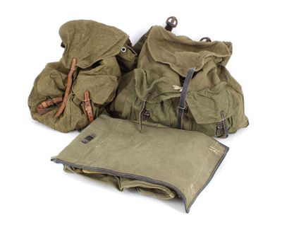 several bags are lined up on a white surface with one bag in the middle