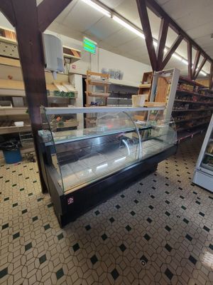 a glass display case in the middle of a store