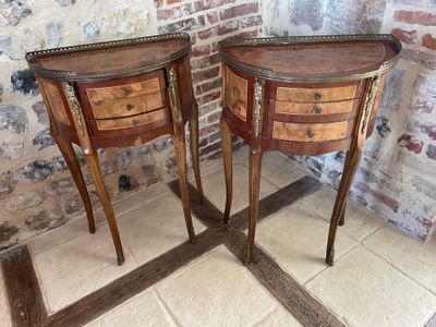 two tables that are standing next to each other in a room