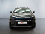 the front view of a grey car in a white room