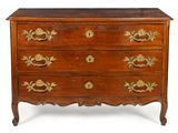 an old wooden chest of drawers with gold decorations on the drawers