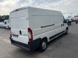 a white van that is parked in a parking lot