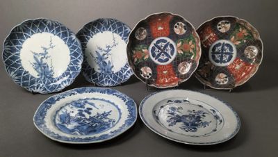 six blue and white plates with oriental designs on them on a table