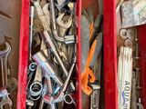 many tools in a red box on the floor