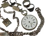 a chain with a clock and a ring on it