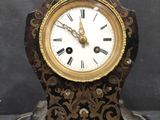 a small clock that is sitting on a table