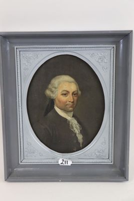 portrait of a man in a black coat and white hair