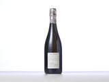 the bottle of wine is sitting on the table with a white background