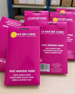 four packs of face masks on a table in front of boxes