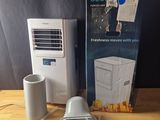 a box of air conditioner sitting on a table next to a box of air conditioner