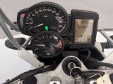 a close up of a motorcycle dashboard with a speedometer
