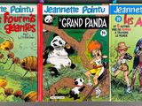 three children ' s comic books are lined up on a shelf