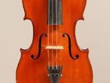 an old violin with a bow hanging from it ' s neck
