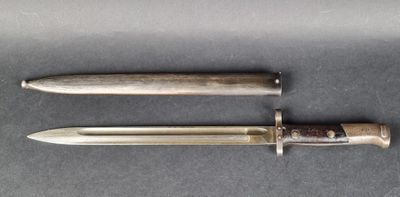 two knives are sitting on a table next to each other