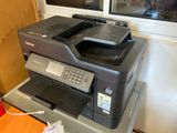 a printer that is sitting on top of a table
