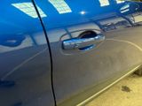 a close up of a car door handle with a sticker on it