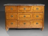 an antique chest of drawers with marble top and brass handles