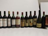 many bottles of wine lined up on a table