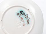 a white plate with a black writing on it